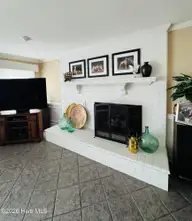 1008 Bateman Drive, Elizabeth City, NC 27909 — 4-bedroom waterfront home in Bateman Estates, Elizabeth City, NC, photo 24 of 74: Family room fireplace