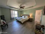 114 Lumis Court, Hampstead, NC 28443 — 4-bedroom home in Dogwood Lakes, Hampstead, NC, photo 17 of 26: Primary bedroom