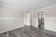 6777 Lewis Drive SE, Winnabow, NC 28479 — 3-bedroom manufactured home in Lewis Acres, Winnabow, NC, photo 13 of 22: Master bedroom