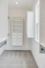 394 Sea Trail Drive W, Sunset Beach, NC 28468 — 4-bedroom home in Sea Trail Plantation, Sunset Beach, NC, photo 23 of 76: Walk-in Closet w/Custom Shelving