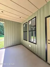 203 Gaston Drive, Elizabeth City, NC 27909 — 3-bedroom waterfront home in Newbegun Land, Elizabeth City, NC, photo 13 of 18: Covered Porch