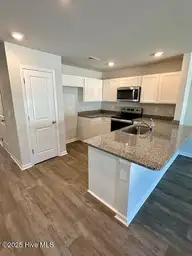 6358 Cowslip Way Lot 184, Leland, NC 28451 — 3-bedroom townhome in SeaBrooke, Leland, NC, photo 5 of 37: Kitchen