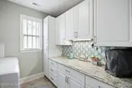6988 Ascension Drive SW, Ocean Isle Beach, NC 28469 — 3-bedroom home in Sunset Ridge, Ocean Isle Beach, NC, photo 15 of 37: Laundry room you want to be in!
