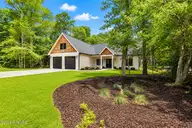 138 Mimosa Boulevard, Pine Knoll Shores, NC 28512 — 4-bedroom home in Pine Knoll Association, Pine Knoll Shores, NC, photo 2 of 50: Front of house 2