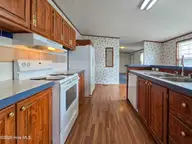 107 Bluebird Drive, Elizabeth City, NC 27909 — 3-bedroom manufactured home in Halls Creek Village, Elizabeth City, NC, photo 5 of 21: Kitchen