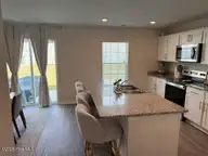1504 Stephenson Drive, Greenville, NC 27834 — 4-bedroom home in Carter Ridge, Greenville, NC, photo 17 of 42: Kitchen view of Backyard
