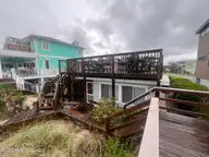 832 Fort Fisher Boulevard N, Kure Beach, NC 28449 — 4-bedroom waterfront home in Hanby Beach, Kure Beach, NC, photo 3 of 5: Back of House