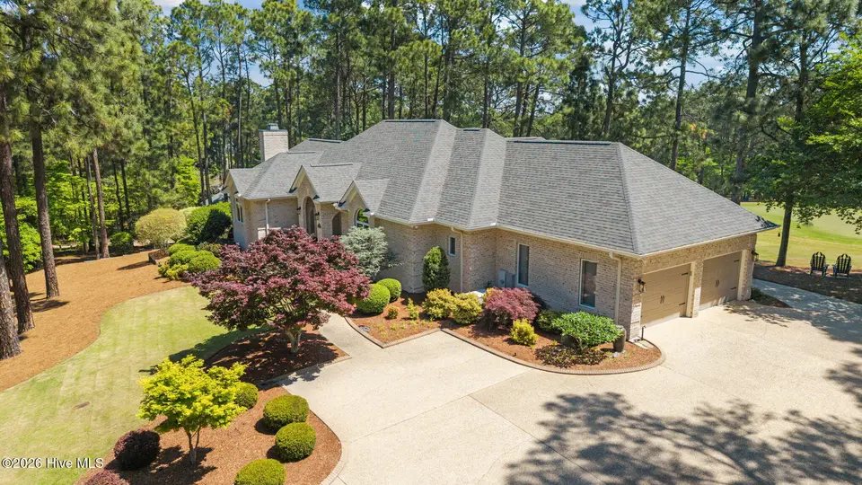 63 Stoneykirk Drive, Pinehurst, NC 28374 — 3-bedroom home in Pinewild CC, Pinehurst, NC, photo 1 of 49: 2-web-or-mls-DJI_20260422120233_0649_D