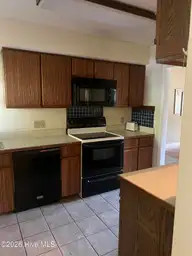 44 Pinehurst Drive, Oak Island, NC 28465 — 2-bedroom home in Caswell Dunes, Oak Island, NC, photo 6 of 14: Kitchen