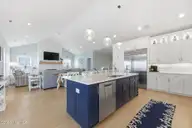 109 Ocean Bluff Drive, Indian Beach, NC 28512 — 6-bedroom waterfront home in Ocean Bluff, Indian Beach, NC, photo 16 of 57: Kitchen and Living Room