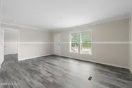 6777 Lewis Drive SE, Winnabow, NC 28479 — 3-bedroom manufactured home in Lewis Acres, Winnabow, NC, photo 6 of 22: Living room