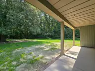 203 Gaston Drive, Elizabeth City, NC 27909 — 3-bedroom waterfront home in Newbegun Land, Elizabeth City, NC, photo 16 of 18: Back Yard to Covered Porch View