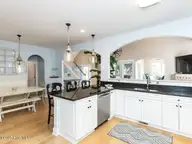 129 Sunset Drive, Cedar Point, NC 28584 — 3-bedroom waterfront home in Plantation Shores, Cedar Point, NC, photo 12 of 46: 013-1280x960-kitchen-dining