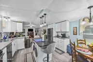 721 Blue Sail Drive SE, Bolivia, NC 28422 — 2-bedroom manufactured home in River Run Plantation, Bolivia, NC, photo 17 of 59: 15_kitchen