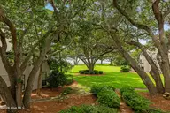 183 Drum Inlet, Morehead City, NC 28557 — 2-bedroom waterfront condo in Brandywine Bay, Morehead City, NC, photo 22 of 55: Balcony off of primary bedroom