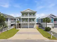 1411 Spot Lane, Carolina Beach, NC 28428 — 4-bedroom home in Wilmington Beach, Carolina Beach, NC, photo 1 of 66: 1-web-or-mls-DJI_20260514153328_0287_D