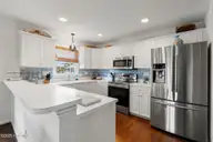 737 Fort Fisher Boulevard N, Kure Beach, NC 28449 — 4-bedroom waterfront home in Kure Estates, Kure Beach, NC, photo 8 of 53: 737FtFisherBlvdN-105
