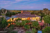 15 Cape Creek Road, Bald Head Island, NC 28461 — 5-bedroom waterfront home in BHI Middle Island, Bald Head Island, NC, photo 1 of 69: 002_15_cape_creek_twilight-12_684