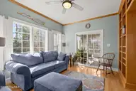 312 Lord Berkeley Drive, Emerald Isle, NC 28594 — 3-bedroom waterfront home in Royall Oaks, Emerald Isle, NC, photo 16 of 61: Sun Room