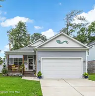 137 NW 16th Street, Oak Island, NC 28465 — 3-bedroom home in Pinners Point, Oak Island, NC, photo 1 of 47