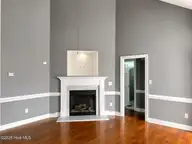 2205 Seagrave Drive, Winterville, NC 28590 — 3-bedroom home in Fieldstream, Winterville, NC, photo 4 of 27: 2205 - living room fireplace