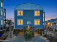 209 W Beach Drive, Oak Island, NC 28465 — 5-bedroom waterfront home in W. Long Beach, Oak Island, NC, photo 2 of 60: 209 W Beach Drive 2