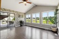 833 Pelican Drive, New Bern, NC 28560 — 3-bedroom waterfront home in Fairfield Harbour, New Bern, NC, photo 9 of 44: Sunroom with wall of Windows