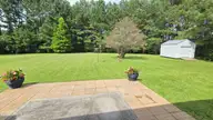 108 Willowbend Drive, Burgaw, NC 28425 — 3-bedroom home in Tealbriar, Burgaw, NC, photo 3 of 27: Large grilling patio