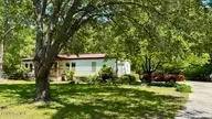 648 Old Church Road, Swansboro, NC 28584 — 3-bedroom manufactured home in Cedar Creek Est, Swansboro, NC, photo 4 of 37: parking pad for 3 vehicles