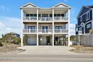 1408 E Beach Drive, Oak Island, NC 28465 — 5-bedroom waterfront home, Oak Island, NC, photo 1 of 62: 1408EastBeachDrive-1