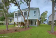 168 NE 31st Street, Oak Island, NC 28465 — 3-bedroom home in Tranquil Harbor, Oak Island, NC, photo 9 of 67: DSC 1528 29 30 Enhancer-040-010-1458x100