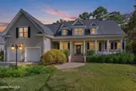 3553 E Medinah Avenue, Southport, NC 28461 — 4-bedroom home in St James, Southport, NC, photo 1 of 65: Photo 31 front at twilight AI