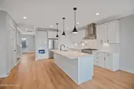 3804 Emerald Drive W, Emerald Isle, NC 28594 — 4-bedroom waterfront townhome in Emerald Isle By The Sea, Emerald Isle, NC, photo 14 of 46: Kitchen Open to Living Room