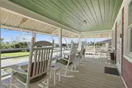 205 Club Colony Drive, Atlantic Beach, NC 28512 — 5-bedroom waterfront home in Club Colony, Atlantic Beach, NC, photo 4 of 38: Front Porch