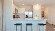 203 Maddox Drive, Aberdeen, NC 28315 — 3-bedroom townhome in Martin Farms, Aberdeen, NC, photo 13 of 37: Kitchen