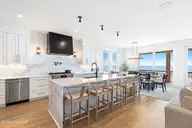 3503 Ocean Drive E & W, Emerald Isle, NC 28594 — 12-bedroom waterfront townhome in Emerald Isle By The Sea, Emerald Isle, NC, photo 2 of 62: Main Kitchen Open to Dining and Living A