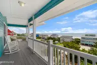 6612 Ocean Drive, Emerald Isle, NC 28594 — 3-bedroom waterfront home, Emerald Isle, NC, photo 15 of 49: Covered deck off of primary suite