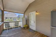 166 NE 5th Street, Oak Island, NC 28465 — 3-bedroom home in Tranquil Harbor, Oak Island, NC, photo 5 of 59: 4_screened porch