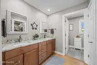 904 Coral Court, New Bern, NC 28560 — 4-bedroom waterfront home in Fairfield Harbour, New Bern, NC, photo 20 of 64: Primary dual vanity