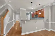 1254 Charleston Common Drive, Leland, NC 28451 — 3-bedroom home in Charleston Common, Leland, NC, photo 16 of 50: Living Room to Kitchen