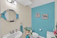 129 NE 13th Street, Oak Island, NC 28465 — 3-bedroom home, Oak Island, NC, photo 18 of 68: Downstairs 1/2 Bathroom