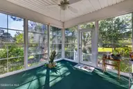 1113 Willow Pond Lane, Leland, NC 28451 — 4-bedroom home in Magnolia Greens, Leland, NC, photo 13 of 73: Sunroom