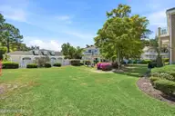 908 Resort Circle Unit 906, Sunset Beach, NC 28468 — 1-bedroom condo in Colony II, Sunset Beach, NC, photo 24 of 35: Green space