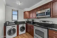 1505 Salter Path Road 304, Indian Beach, NC 28512 — 2-bedroom waterfront condo in Summer Winds Condominiums, Indian Beach, NC, photo 12 of 53: Kitchen & Laundry
