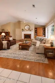 618 Oyster Bay Drive, Sunset Beach, NC 28468 — 3-bedroom home in Sea Trail Plantation, Sunset Beach, NC, photo 8 of 62: Living room virtual