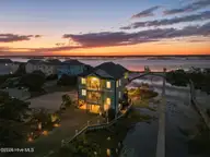 1150 N Anderson Boulevard, Topsail Beach, NC 28445 — 4-bedroom waterfront home, Topsail Beach, NC, photo 1 of 64: 10-web-or-mls-DJI_20261006191602_0198_D