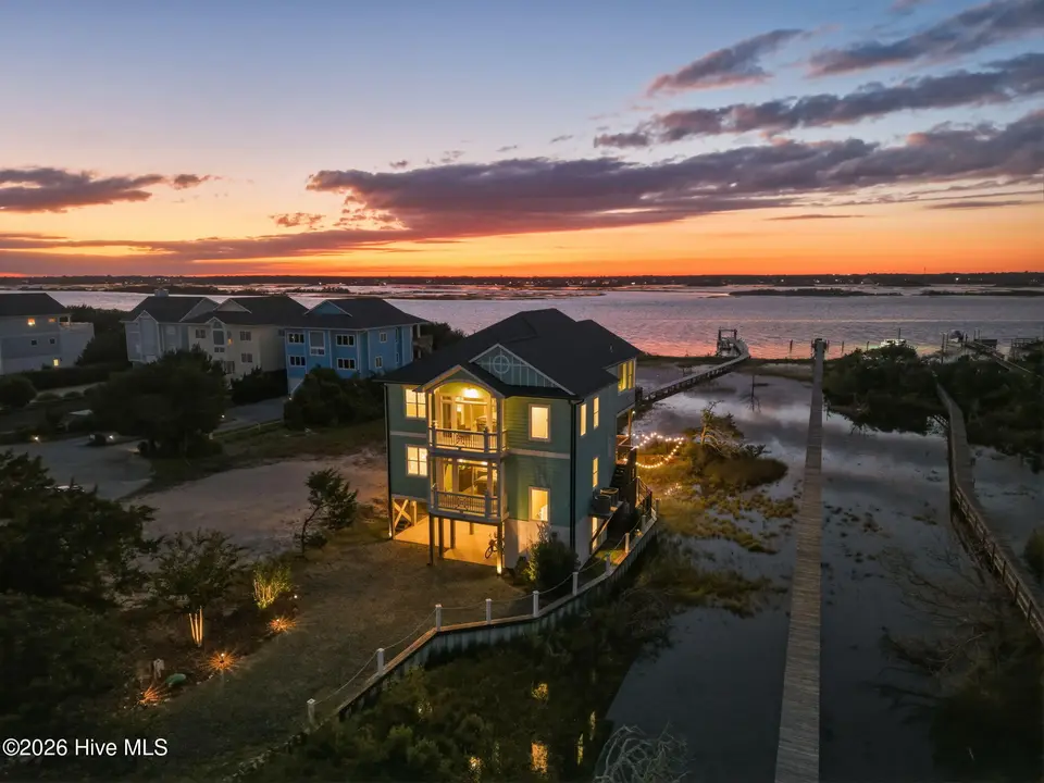 1150 N Anderson Boulevard, Topsail Beach, NC 28445 — 4-bedroom waterfront home, Topsail Beach, NC, photo 1 of 64: 10-web-or-mls-DJI_20261006191602_0198_D