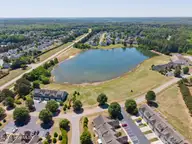128 Wembley Drive, Clayton, NC 27527 — 3-bedroom townhome in Flowers Plantation, Clayton, NC, photo 20 of 22: pond