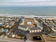 918 N New River Drive 322, Surf City, NC 28445 — 1-bedroom condo in Surf Condominiums, Surf City, NC, photo 3 of 38: DJI_20250220173803_0699_D