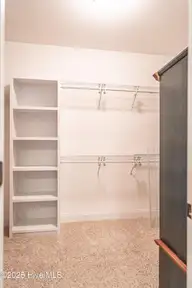 255 Champions Ridge Drive, Southern Pines, NC 28387 — 3-bedroom home in Mid South Club, Southern Pines, NC, photo 24 of 56: Master Closet